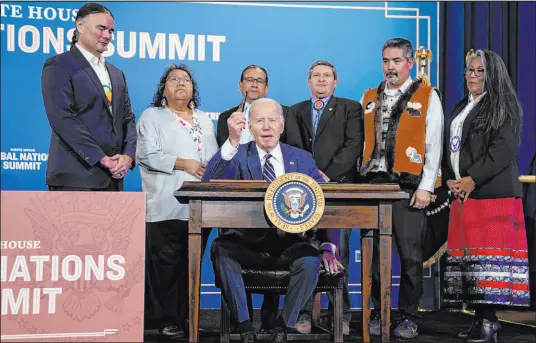  ?? Evan Vucci The Associated Press ?? President Joe Biden speaks before signing an executive order Wednesday at the White House Tribal Nations Summit at the Department of the Interior in Washington. Hundreds of tribal leaders are in Washington this week for the annual summit.