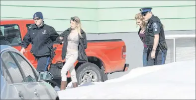  ?? JOE GIBBONS/THE TELEGRAM ?? Two women are taken into police custody after they walked out with their hands in the air as per police commands during a standoff at a house on Jersey Avenue in Mount Pearl on Tuesday.