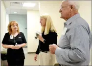  ?? TIMES photograph by Annette Beard ?? Kent Webb, right, and Lisa Webb Crowder, visit with lab tech Becky Griffin, as they view the lab dedicated to Lisa’s mother, Mary Margaret Webb, former lab tech for Dr. Steve Goss, president of Mercy.