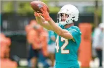  ?? LYNNE SLADKY/AP ?? Dolphins cornerback Clayton Fejedelem takes part in drills at the team’s practice facility on June 7 in Miami Gardens.