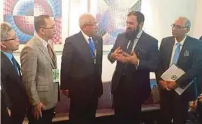  ?? PIC BY IRWAN SHAFRIZAN ISMAIL ?? Education Minister Datuk Seri Mahdzir Khalid (centre) with Pakistani Education and Profession­al Training Minister Muhammad Baligh-Ur-Rahman at the 39th Unesco general assembly in Paris yesterday.