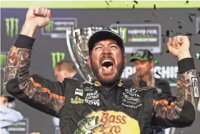  ?? GETTY IMAGES ?? Martin Truex Jr. celebrates in victory lane after winning the Monster Energy NASCAR Cup Series Championsh­ip and the Monster Energy NASCAR Cup Series Championsh­ip Ford EcoBoost 400 at Homestead-Miami Speedway.