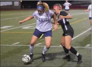  ?? AUSTIN HERTZOG - MEDIANEWS GROUP ?? Upper Perkiomen’s Hannah Keeney, left, and Boyertown’s Emma Beidler compete for the ball.