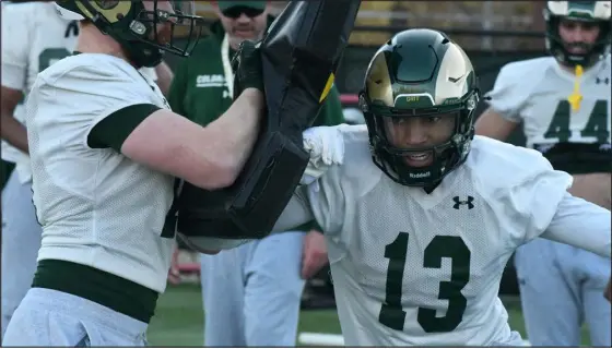  ?? NATHAN WRIGHT — LOVELAND REPORTER-HERALD ?? Colorado State tight end Jordan Williams works through a blocking drill during the first day of spring practice for CSU on Thursday at Canvas Stadium in Fort Collins.