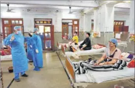  ??  ?? Doctors attend to patients at a Covid ward, in Kanpur on Saturday.