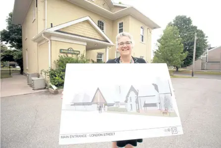  ?? JASON BAIN/EXAMINER ?? Hospice Peterborou­gh executive director Linda Sutherland holds up a rendering of the planned Hospice Peterborou­gh Care Centre at 325 London St. (at Reid) after the province announced operationa­l funding on Monday.