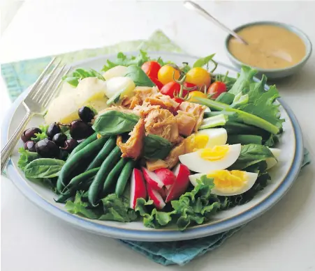  ??  ?? This niçoise-style salad combines a range of Island ingredient­s, such as tuna from a Nanaimo cannery, garden veggies and eggs.