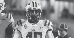  ?? MICHAEL WOODS/AP ?? LSU linebacker Devin White takes a break before the Arkansas game on Nov. 10. White said he has great respect for UCF but doesn’t believe the Knights belong in any national championsh­ip discussion.