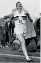  ??  ?? — AP In this May 6, 1954 file photo, Roger Bannister hits the tape to break the four-minute mile in Oxford, England.