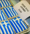  ?? Holy Trinity Greek Orthodox Church, ?? Greek Flag Cookies were a hit at last year’s food festival at Holy Trinity Greek Orthodox Church in Ambridge. This year, there will be a takeout-only festival through Saturday.