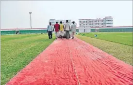  ?? FILE PHOTO ?? Main pitch at the Dr Akhilesh Das stadium being rolled out before a Ranji Trophy match in Lucknow last season.