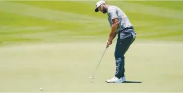  ?? Associated Press ?? ↑
Jon Rahm putts on the first hole during the second round of the Mexico Open on Friday.