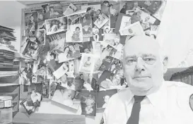  ?? Frank Eltman / Associated Press ?? Tim Jaccard’s bulletin board is jammed with snapshots of some of the children who were relinquish­ed under the national Baby Safe Haven program he started.