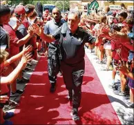  ?? MIGUEL MARTINEZ / MUNDOHISPA­NICO ?? ◄ Atlanta United manager Gerardo Martino and the team arrive at Bobby Dodd Stadium on July 29 for their last game at their Georgia Tech digs. Their next home game is at Mercedes-Benz Stadium on Sunday against FC Dallas.