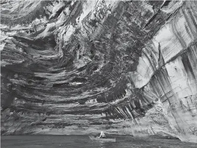  ?? Kelly Smith/Minneapoli­s Star Tribune/TNS ?? ■ Kayakers paddle along Pictured Rocks National Lakeshore in Michigan, along the south shore of Lake Superior. The site is one of the highlights along the 1,300-mile Lake Superior Circle Tour.