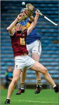  ??  ?? TUSSLE: Niall Mitchell (left) in action against Tipp’s Tomas Hamill