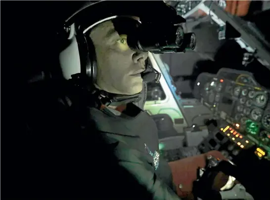  ?? MARTIN DE RUYTER/STUFF ?? Nelson Marlboroug­h Rescue Helicopter pilot Baz McAuliffe wearing night vision goggles. The rescue helicopter is starting a campaign to fund raise to replace the goggles, which enable the crew to fly at night.