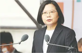 ?? CHIANG YING-YING / THE ASSOCIATED PRESS FILES ?? Taiwanese President Tsai Ing-wen has broken barriers by presiding over the first same-sex marriage law in Asia, columnist Terry Glavin notes, and by rising from her place as the youngest of 11 children
in a working-class family to become the first woman to lead a major Taiwanese political party.