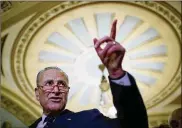  ?? WIN MCNAMEE / GETTY IMAGES ?? Senate Minority Leader Chuck Schumer, D-N.Y., met with senior Senate Democrats on Tuesday morning to win their support for the bill.