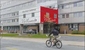  ?? Canadian Press photo ?? A cyclist heads past Northwood Manor, one of the largest nursing homes in Atlantic Canada, in Halifax earlier this month. A new study finds the proportion of Canadian COVID-19 deaths that have occurred in long-term care facilities is about twice the average of rates from other developed nations.