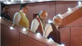  ?? — PTI ?? Prime Minister Narendra Modi arrives to address supporters at the BJP headquarte­rs in New Delhi on Thursday. BJP president Amit Shah and working president J.P. Nadda are also seen.