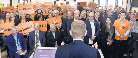  ?? PHOTO PETER MCINTOSH ?? Tough crowd . . . Education Minister Chris Hipkins addresses a public meeting in Invercargi­ll yesterday about the proposal to merge 16 polytechni­cs and institutes, including the Southern Institute of Technology.