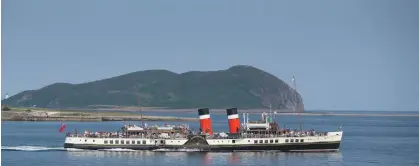  ??  ?? Left: The Waverley, photograph­ed in Campbeltow­n Loch, will be back in operation for summer 2020. Above: The Waverley’s new boilers take shape.