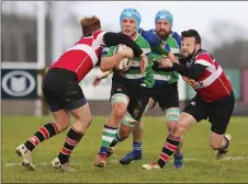  ??  ?? Gorey’s Eoin Walsh is tackled by Wicklow’s Alex Porter.