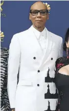  ??  ?? RuPaul’s suit by Calvin Klein makes “a political statement” with black Statues of Liberty.