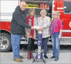  ?? LAWRENCE POWELL ?? Brenda Hamilton, Vicky Smith, and Barb Francis presented a cheque for $17,000 for this Jaws of Life to Annapolis Royal Fire Chief Andrew Cranton recently. Missing is the fourth member of the auxiliary, Louise Oliver.