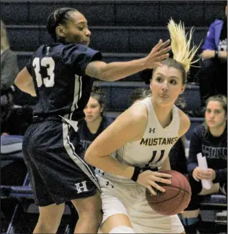  ?? Haley Sawyer/The Signal (See additional photos on signalscv.com) ?? TMU’s Hannah Forrar keeps the ball from Hope Internatio­nal University’s Vinessa Perryman during a game at The Master’s University on Thursday.