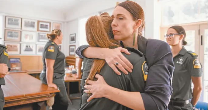  ??  ?? New Zealand Prime Minister Jacinda Ardern meets first responders to the White Island tragedy on Tuesday.