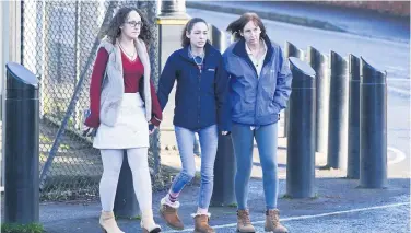  ??  ?? Family and friends of Nathan Gibson leave Lisburn Magistrate­s Court yesterday