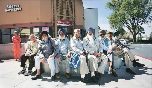 ?? Jim Wilson/the New York Times ?? Indian men gather at a shopping centre plaza in Fremont, California to discuss the news from home.