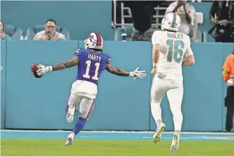  ?? LYNNE SLADKY/AP ?? Buffalo Bills wide receiver Deonte Harty runs for a touchdown during the fourth quarter of a Week 18 game at Miami.