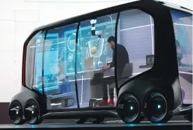  ?? (Rick Wilking/Reuters) ?? TOYOTA MOTOR CORP. displays the e-Palette, a new fully self-driving electric concept vehicle designed to be used for ride hailing, parcel delivery and other uses, at the Consumer Electronic­s Show in Las Vegas on Monday.