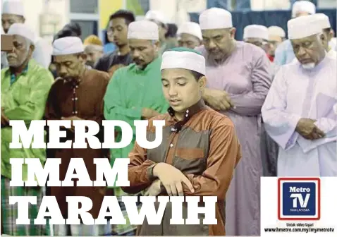  ??  ?? FURQAN (tengah) memimpin solat Tarawih.