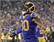  ?? MARK J. TERRILL — THE ASSOCIATED PRESS ?? Los Angeles running back Todd Gurley celebrates after a touchdown during a game against the Vikings earlier this season. Gurley and the Rams are looking to get back on track following a loss to the Bears last week.