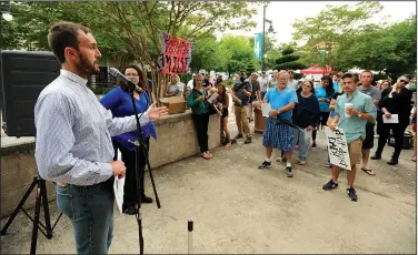  ?? NWA Democrat-Gazette/ANDY SHUPE ?? The Rev. Clint Schnekloth, founder and CEO of Canopy NWA and pastor of Good Shepherd Lutheran Church in Fayettevil­le, speaks Saturday during the rally.