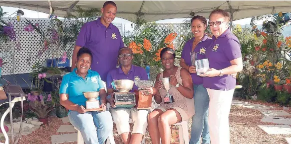  ?? PHOTOS BY CLAUDIA GARDNER ?? Members of the Ocho Rios Orchid Society pose with their awards. Seated (from left) are Sherril Lindo, Monica Walters and Ann Marie Smith. Standing (from left) are Richard Grant, Colleen Hoilett and Denyse Perkins.