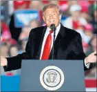  ?? JEFF ROBERSON — THE ASSOCIATED PRESS ?? President Donald Trump speaks at a rally in Illinois on Saturday. Eager to focus voters on immigratio­n in the lead-up to the midterm elections, Trump has escalated his threats against a migrant caravan trudging slowly toward the U.S. border.