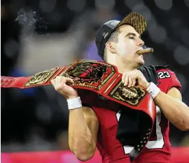  ?? AP ?? Georgia QB Stetson Bennett passed for 304 yards and 4 TDS and ran for 2 more scores in Monday’s 65-7 win over TCU in the CFP national championsh­ip game. The 58-point margin of victory is the largest in any bowl season game in college football history.