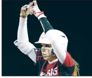  ?? NWA Democrat-Gazette/ANDY SHUPE ?? Arkansas designated hitter Danielle Gibson celebrates an RBI single.