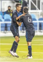  ?? Bob Kupbens / Icon Sportswire via Getty Images ?? San Jose’s turnaround may have inspired Chris Wondolowsk­i ( left), celebratin­g with Shea Salinas, to return next season.