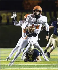  ?? TIMOTHY ARRICK — MEDIANEWS GROUP PHOTO ?? Brother Rice quarterbac­k Jake Coulter spent a lot of time trying to evade Chelsea defenders as the Warriors fell 23-0 in the Division 3 District Finals on Friday in Chelsea.