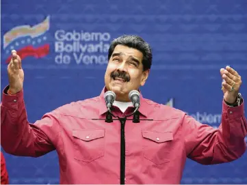  ?? ARIANA CUBILLOS AP ?? Venezuelan President Nicolás Maduro talks to reporters in Caracas, Venezuela, on Sunday. Maduro claims his regime won a two-thirds majority in Sunday’s congressio­nal elections, but much of the world claims the voting was rigged.