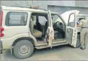  ?? HT PHOTO ?? A police official inspecting an abandoned SUV in Pathankot on Wednesday.