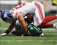  ?? Julia Nikhinson / Associated Press ?? Giants linebacker Blake Martinez tackles Jets running back Breece Hall in the first half of a preseason game on Aug. 28 in East Rutherford, N.J.