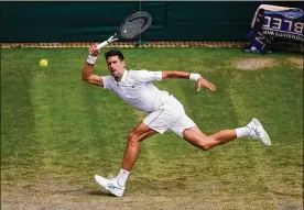  ?? LAURENCE GRIFFITHS / GETTY IMAGES ?? Novak Djokovic of Serbia plays a forehand in his fourth-round match against Ugo Humbert of France. Djokovic won, 6-3, 6-2, 6-3.