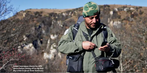  ??  ?? Arman Gabrielyan checks his GPS device before setting off on the first day’s hike in Ijevan State Sanctuary